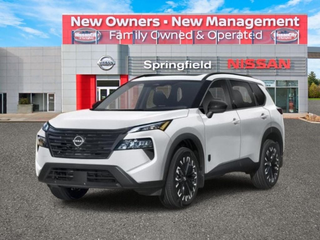 2026 Nissan Rogue Dark Armor™ in Everest White Pearl Tricoat — front three-quarter view