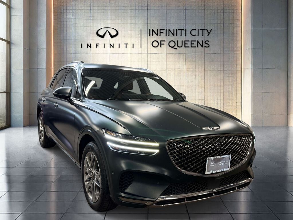 2023 Genesis GV70 2.5T in Brunswick Green — front three-quarter view