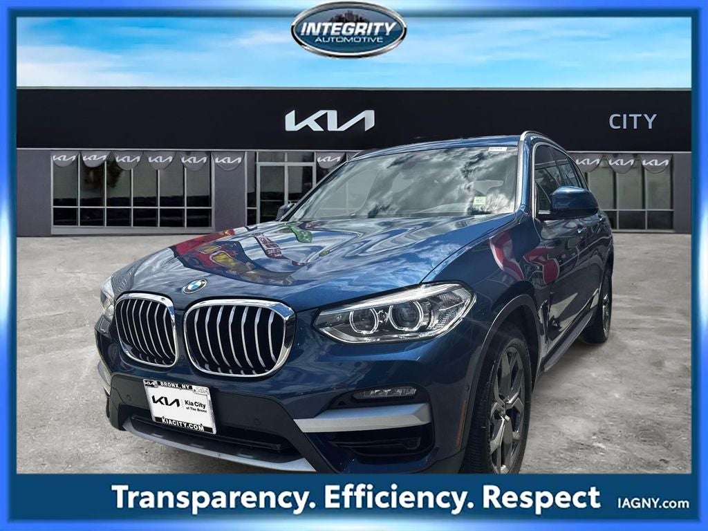 2021 BMW X3 xDrive30i in Phytonic Blue Metallic — front three-quarter view